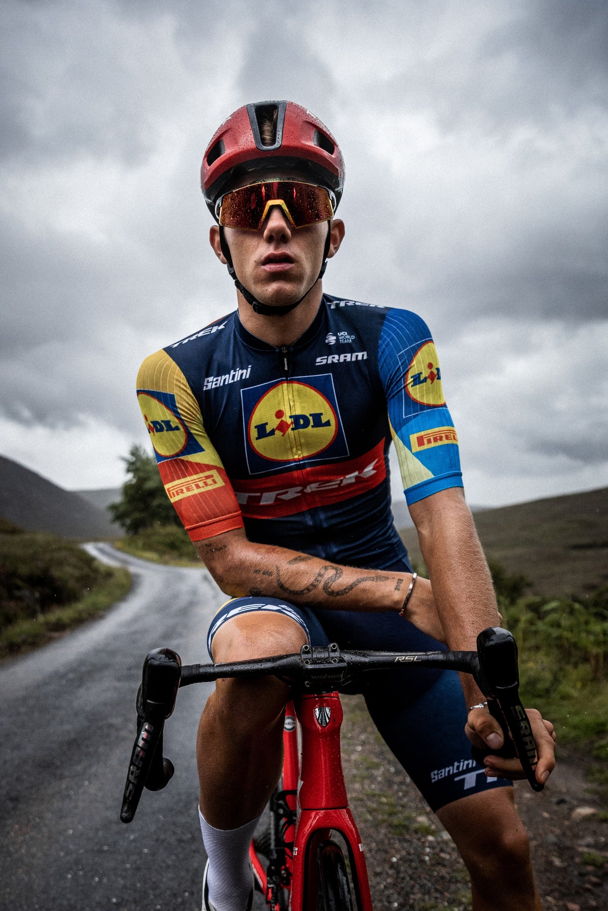 Thibau Nys wearing the 100Percent® Aerocraft® Sunglasses on a cloudy background.